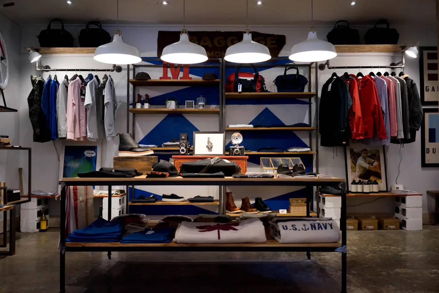 The interior of an independent clothing shop, stocked and lit for trading
